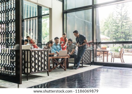 ストックフォト: Group Of Cheerful Employees Drinking Coffee In The Lounge Area