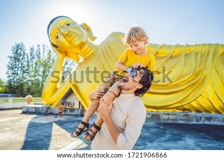 Stock fotó: Happy Tourists Dad And Son On Background Oflying Buddha Statue