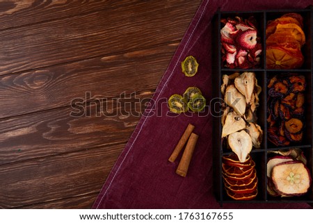 Foto stock: Various Snacks In Vintage Wooden Box On Light Background Onion Ringsnachos Salty Peanuts With Pot