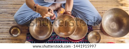 Foto stock: Banner Long Format Nepal Buddha Copper Singing Bowl At Spa Salon Young Beautiful Woman Doing Massa