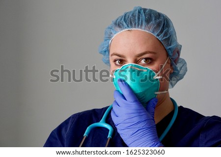 Stock photo: Young Female Doctor Wearing The N95 Respiratory Protection Mask Against Infectives Diseases Vector