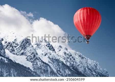 Foto stock: Mountain Landscape With Snow And Hot Air Balloon Flying In The S