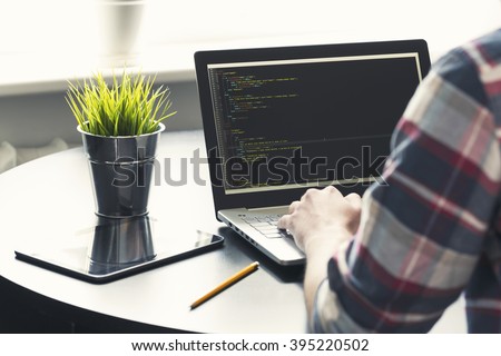 Foto stock: Programmer Profession - Man Writing Programming Code On Laptop C