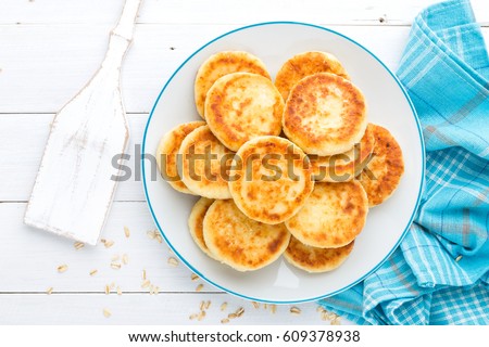 Stock fotó: Cottage Cheese Pancakes With Oats Syrniki On White Rustic Background