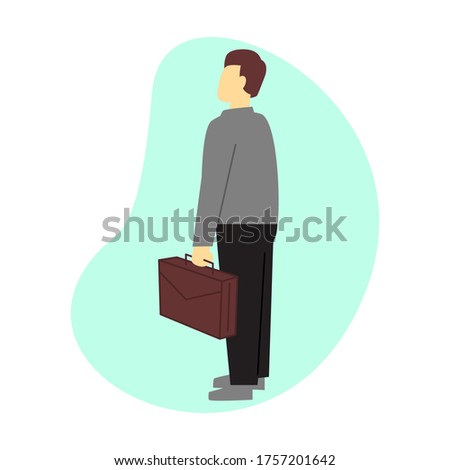 Stock fotó: Handsome Young Businessman Holding A Black Suitcase While Standi