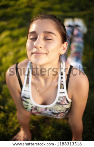 Stock photo: Young Sports Woman Outdoors On Grass Make Sport Exercises With Dumbbells
