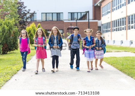 Stockfoto: Great Portrait Of School Pupil Outside Classroom Carrying Bags
