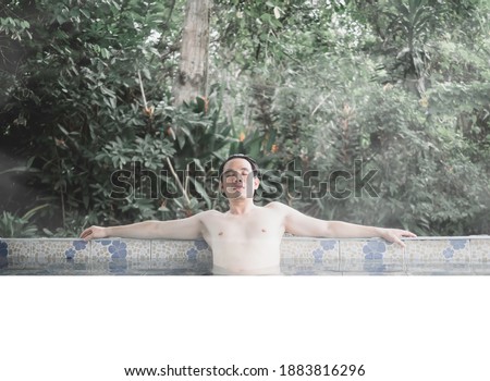 Stok fotoğraf: Geothermal Spa Man Relaxing In Hot Spring Pool Young Man Enjoying Bathing Relaxed In A Blue Water