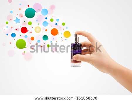 Foto d'archivio: Close Up Of Woman Hands Spraying Colorful Bubbles From Beautiful Perfume Bottle