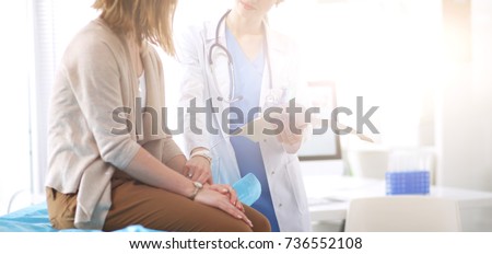 Stock photo: Smiling Female Doctor Healthcare Professional Sitting On Bench Outside