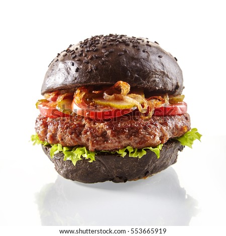Stok fotoğraf: Black Burger A Burger With A Black Roll Slices Of Juicy Marble Beef Fused Cheese Fresh Salad And
