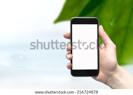 ストックフォト: Female Hands Holding Young Plant In Hands Against Spring Green B