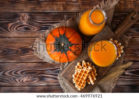 Stock fotó: Bottle And Glass Of Fresh Pumpkin Juice With Wafer And Pumpkin O