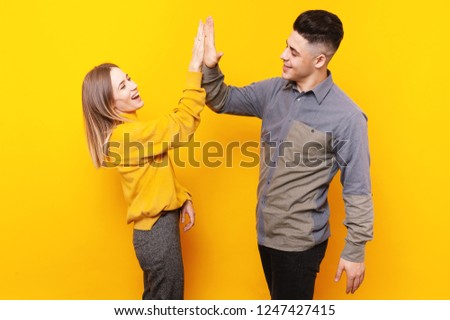 Foto d'archivio: Excited Fitness Sport Loving Couple Gives A High Five To Each Other