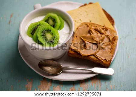 Сток-фото: Natural Yoghurt With Kiwi And Peanut Butter Toast Healthy Breakfast