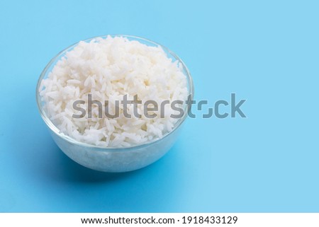 Foto stock: Red Bowl With Boiled Organic Basmati Jasmine Rice With Red Chopsticks And Sweet Soy Sauce On Bamboo