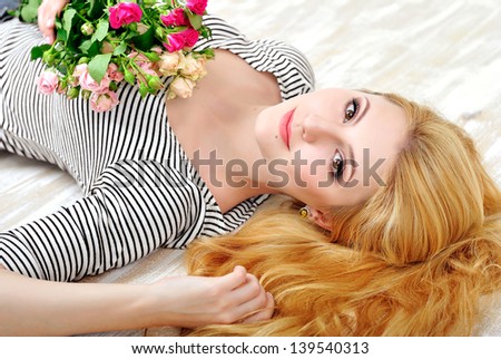 Сток-фото: Smiling Happy Red Haired Girl In A Pink Shirt And Delicate Rose In Her Hand With Tattoo Copy Space