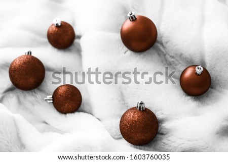 Stock foto: Chocolate Brown Christmas Baubles On White Fluffy Fur Backdrop