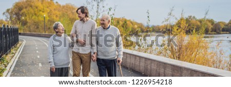 Stock foto: Banner Long Format Happy Senior Citizens In The Autumn Forest Family Age Season And People Conce