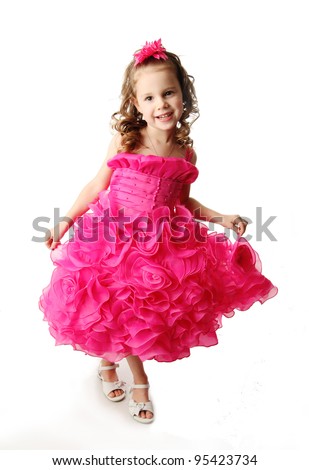 Foto stock: Beautiful Brunette Girl Wearing In Pink Dress Isolated On Black