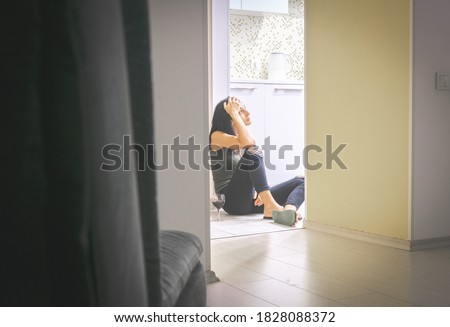 Stockfoto: Low Angle View Of A Woman Thinking With Her Hands On Her Cheeks