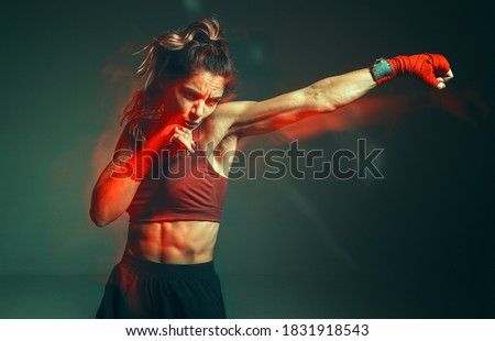 Сток-фото: Concentrated Fighter With Bandage On Hands In Fighter Position A