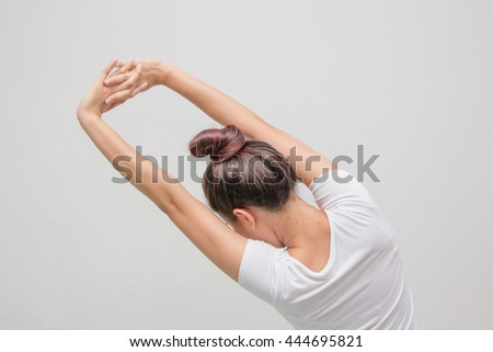 Stok fotoğraf: Back View Portrait Of A Young Woman Stretching Hands And Looking At Window
