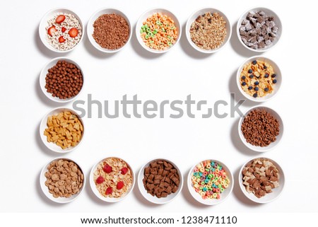 [[stock_photo]]: Chocolate Pads Corn Flakes In White Bowl Isolated Top View Cereals