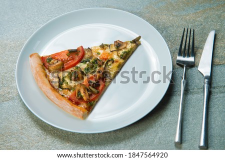 ストックフォト: Top View Of A Slice Of Pizza On A Plate Cutlery Knife And Fork