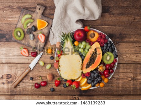 [[stock_photo]]: Fresh Raw Organic Berries On Vintage Chopping Boards On Kitchen Table Background Space For Text To