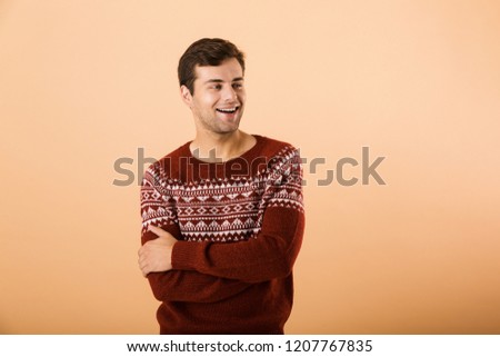 Stok fotoğraf: Image Of Brunette Man 20s With Bristle Wearing Knitted Sweater P