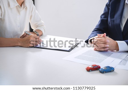 Foto stock: Car And Home Insurance Concept Broker Agent Presenting And Cons