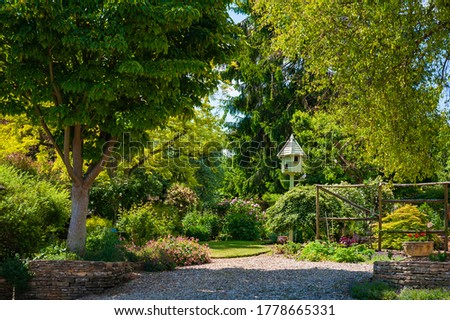 Stock photo: Bird House On A Tree Among The Green Leaves In Springtime Shelt