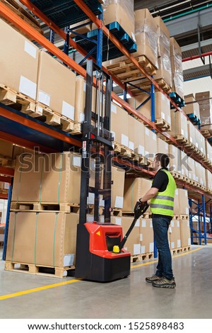 Stockfoto: Stacker In Warehouse