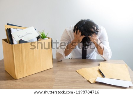 Stok fotoğraf: Businessmen Are Holding Resignation Document And Packing Persona