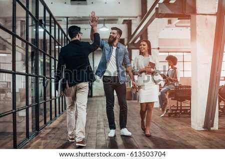 Stok fotoğraf: Cheerful Colleagues Giving High Five