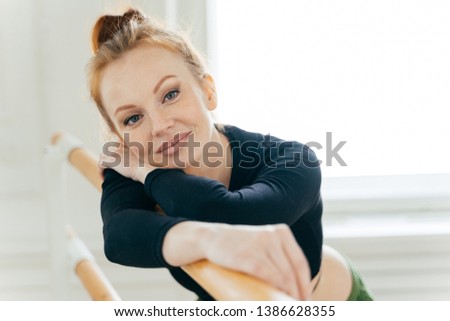 Сток-фото: Close Up Portrait Of Ginger Attractive Female Dancer With Combed Hair Makeup Wears Black Top Lean