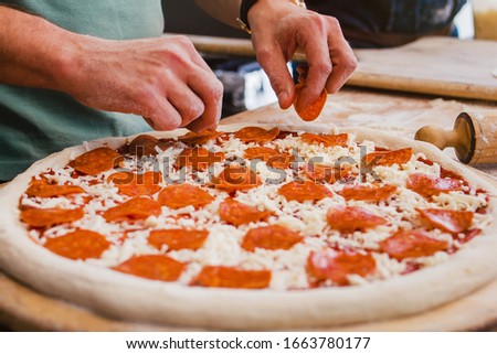 Сток-фото: Preparation For Baking Of Pepperoni Pizza With Raw Dough Salami Spicy Chorizo With Wheel Cutter And