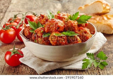 Foto stock: Traditional Spicy Meatballs In Tomato Sauce With Pepper Garlic And Parsley With Onion And Cleaver O