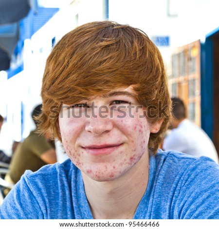 Stock fotó: Smart Boy In Puberty Sitting On An Outdoor Table In The Village