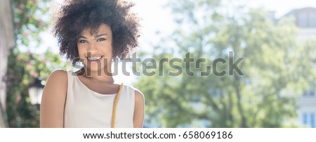 Stock photo: Cute African Young Woman With Stylish Makeup Standing And Posing