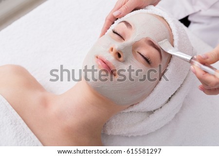 Stock fotó: Spa Treatment Beautiful Woman With Facial Mask At Beauty Salon