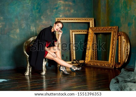 ストックフォト: Beauty Rich Brunette Woman In Luxury Interior Near Empty Frames Vintage Elegance Close Up