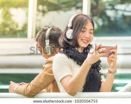 Foto d'archivio: Portrait Of Excited Asian Teenage Gamer Boy Playing Video Games