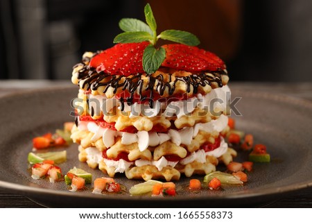 Stock fotó: Closeup Of Ripe Strawberries In A Plate Poured With Fresh Cream On A Dark Concrete Background With C