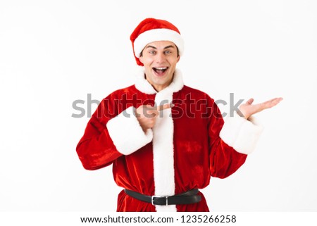 Сток-фото: Image Of Optimistic Man 30s In Santa Claus Costume Holding Dolla