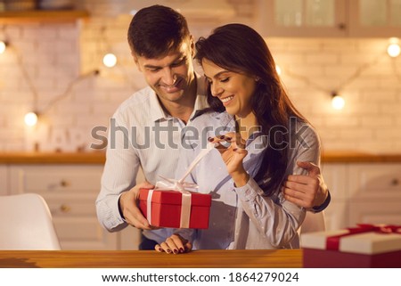 Сток-фото: A Pair Of Lovers In Anticipation Of The Celebration Of The New Year On The Background Of Decorated H