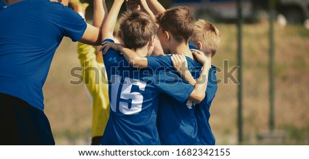 Kids Sport Team Gathering And Rising Hands Children Play Sports Boys In Sportswear Jersey Uniforms ストックフォト © matimix