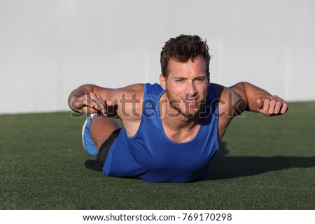 [[stock_photo]]: Fitness Training Back Fat Exercise Fit Man Doing Superman Variation Of Lower Body Workout Strong At
