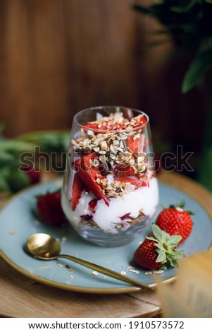 Foto stock: Homemade Granola In A Plate Sliced Strawberries Yogurt Almonds Blueberries - Ingredients For Nat